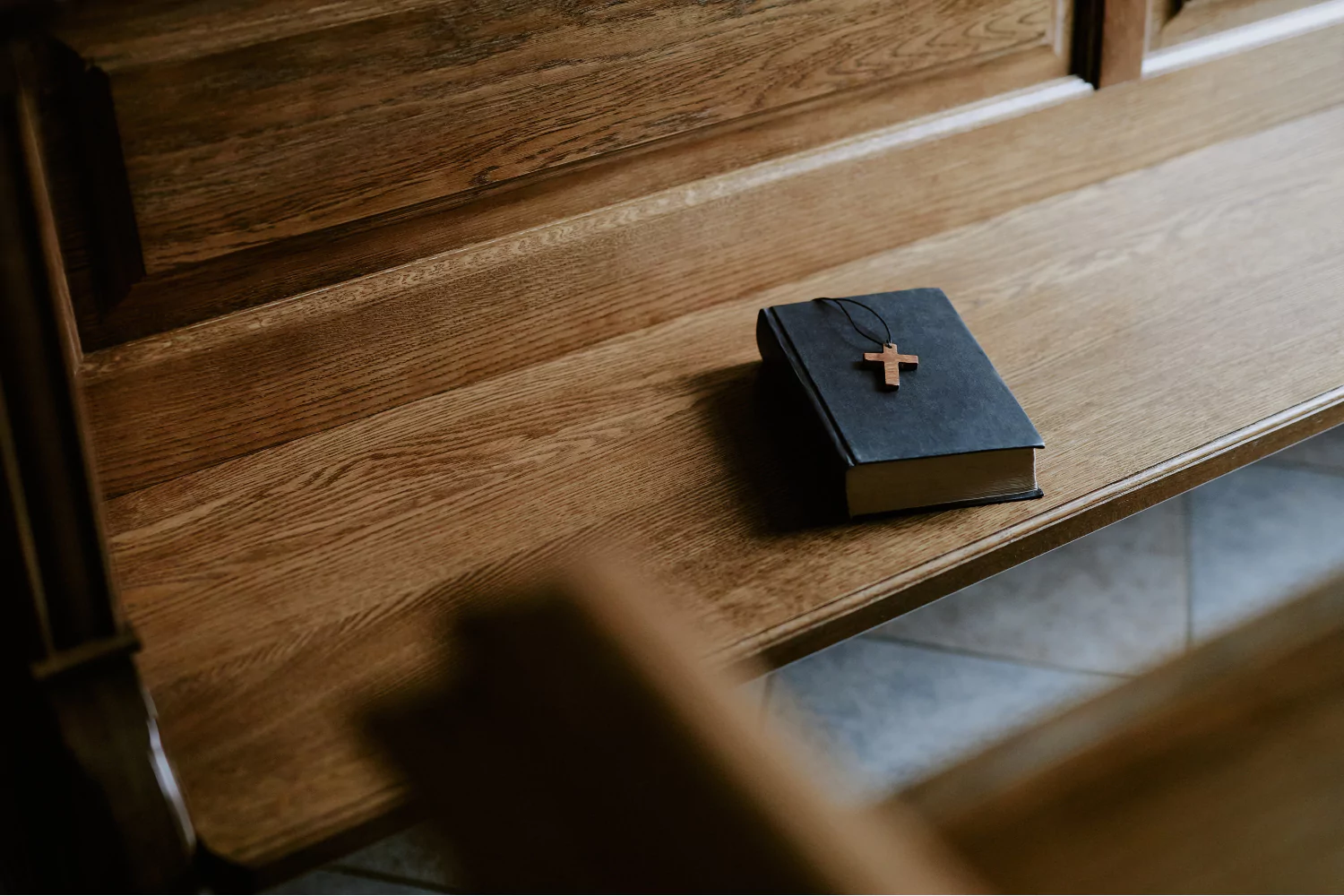 lonely church pew, symbolizing the pressures of pastoral ministry