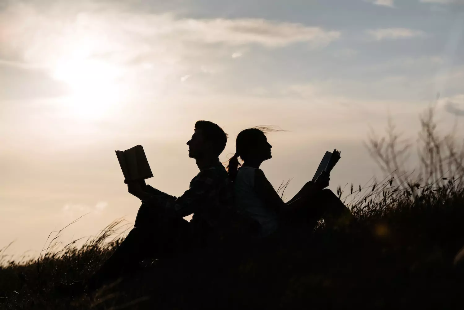 Couple reading books together
