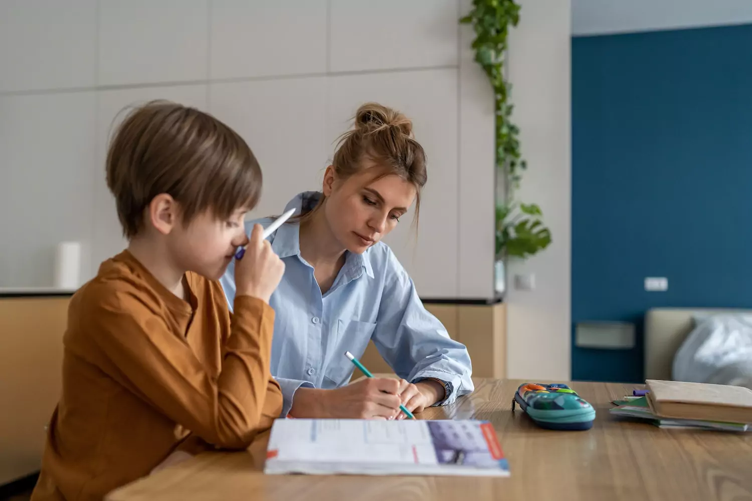 A homeschooling mom works with her young son on a lesson. It's back-to-school time. Or, in our case, it's back-to-homeschool. There's much to do, and it's good to remember why we do it all—for God's glory.