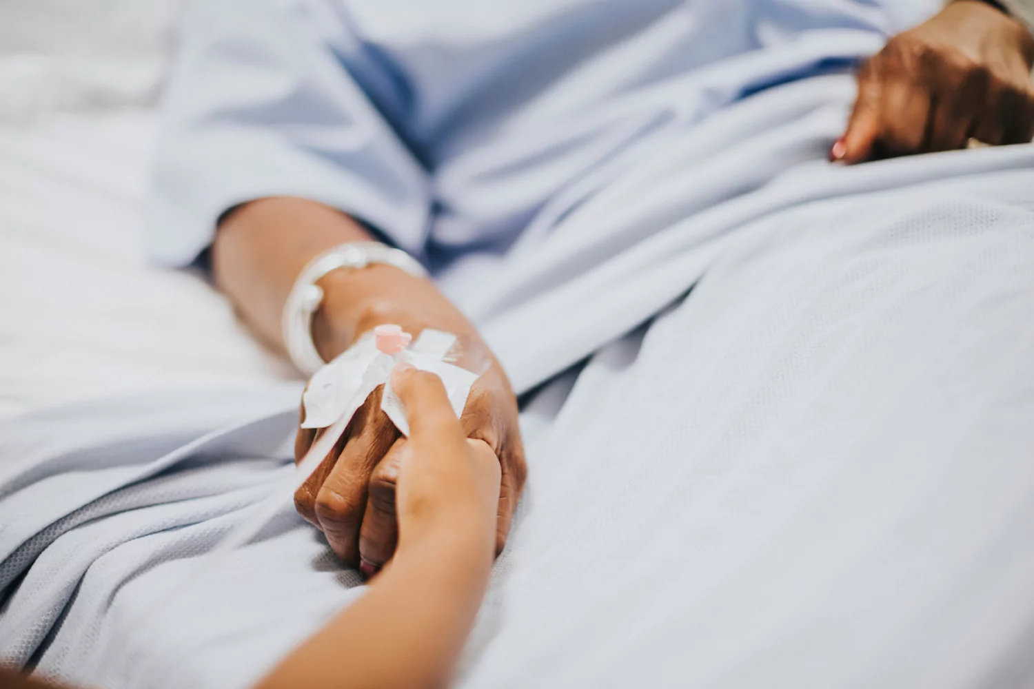 image of a hospital patient receiving intravenous treatment