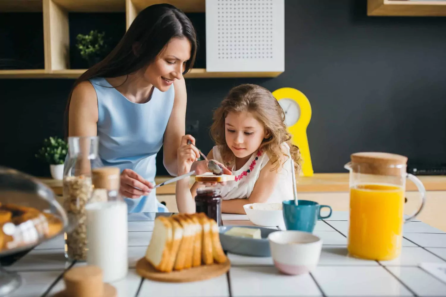 A pastor's wife makes her daughter breakfast on Sunday morning.