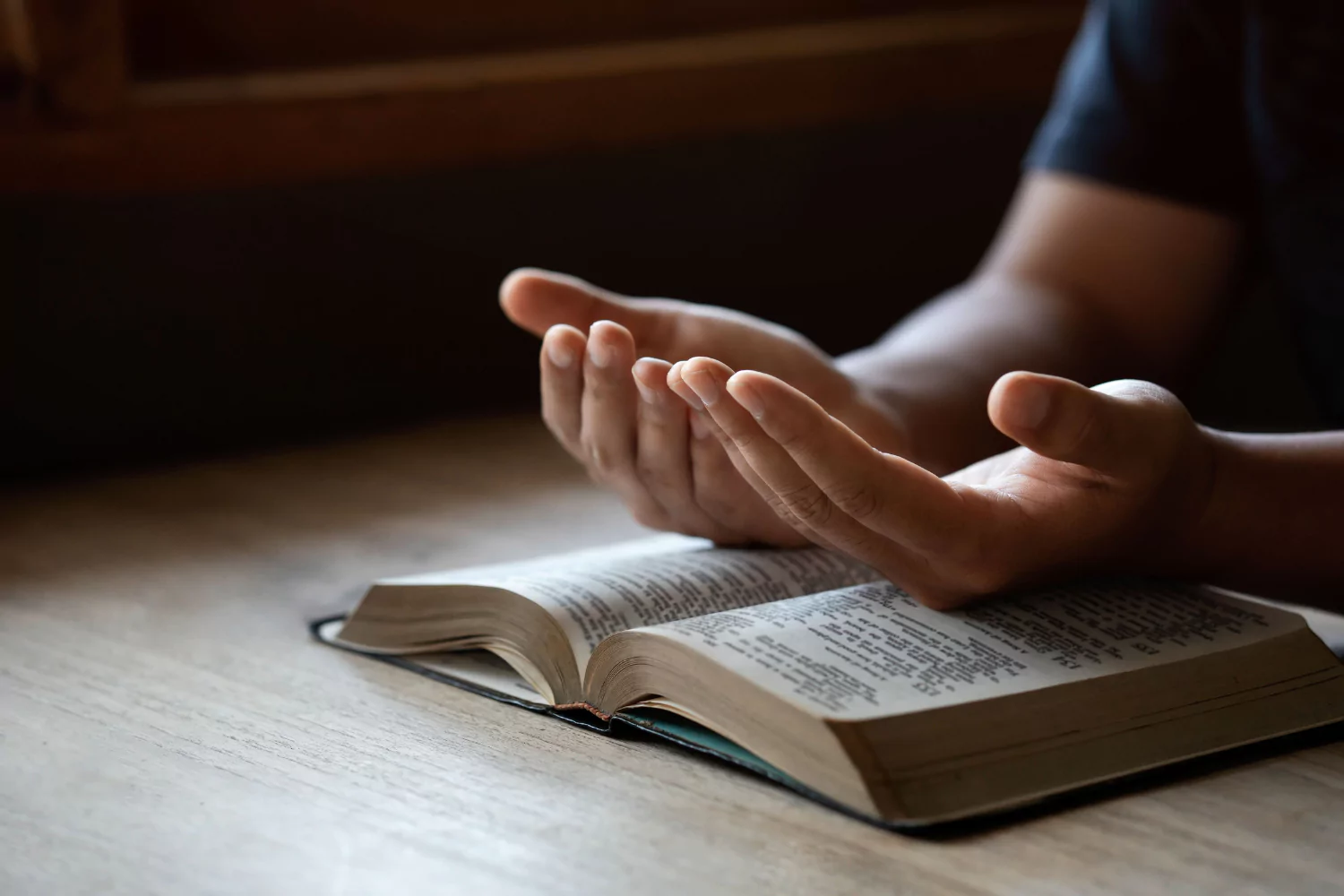 pastor praying for his church